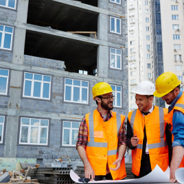 Engineers reviewing construction plans